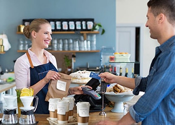 Man paying for to-go order at checkout