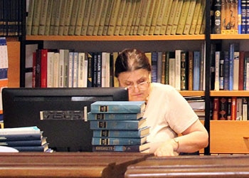 Librarian at checkout desk