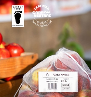 Linerless Weigh Scale Label on Food Packaging (Bag of Apples) with certified CarbonNeutral® logo