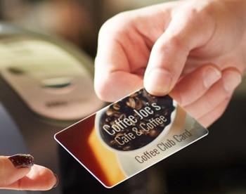 Customer Being Handed a Coffee Shop Loyalty Card