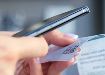 Person scanning QR code on receipt