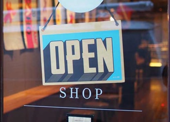 Shop Open Sign Hanging on Store Door