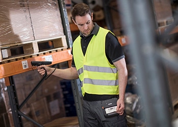 Man Scans Barcode Label in Warehouse & Prints Label on Mobile Printer